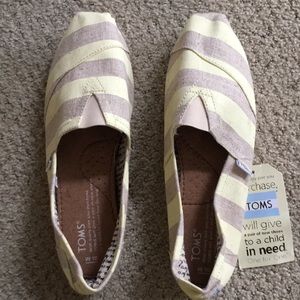 Toms striped slip-ons.